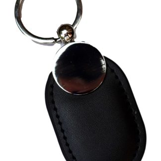 Unmarked leather NFC keychain for a digital memorial on a white background.
