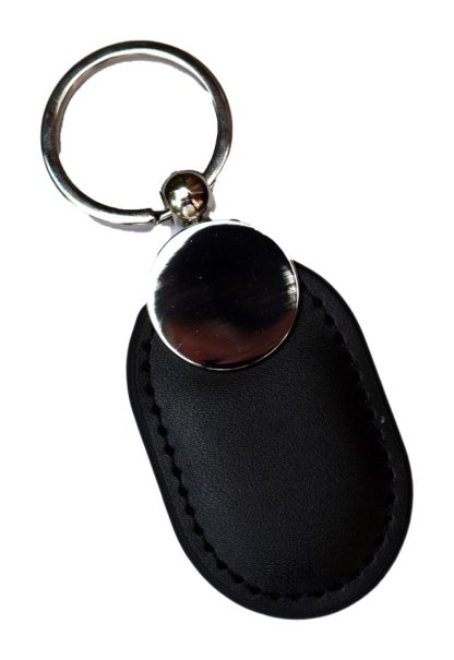 Unmarked leather NFC keychain for a digital memorial on a white background.